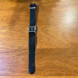 Anne Klein ladies watch. Black leather band. Square silvertone framed face.